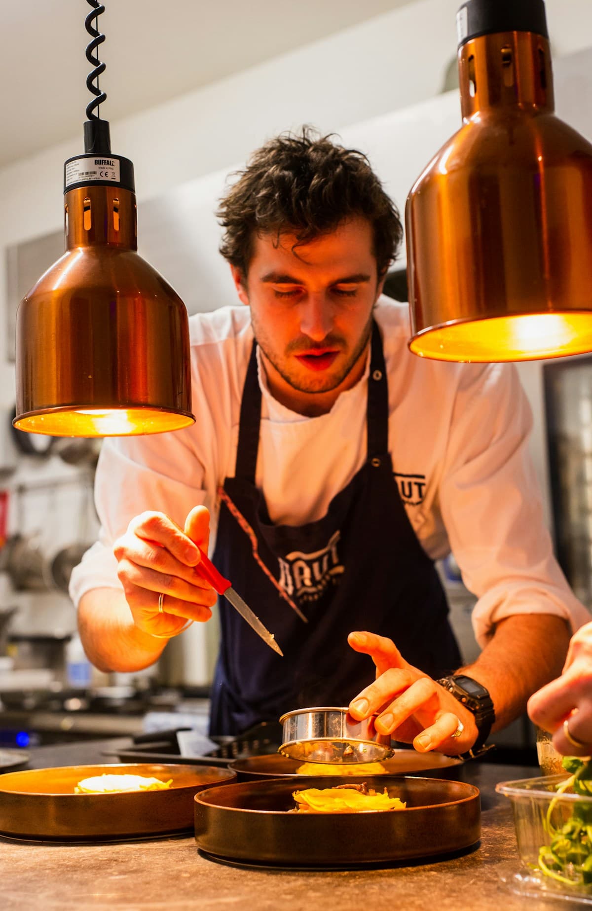 Professional chef focused at the station